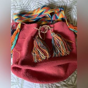 Brand new.  2 colors available, Salmon and beige with colorful tassels.